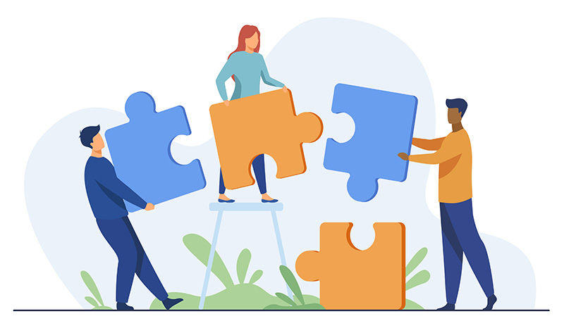 Partners holding big jigsaw puzzle pieces